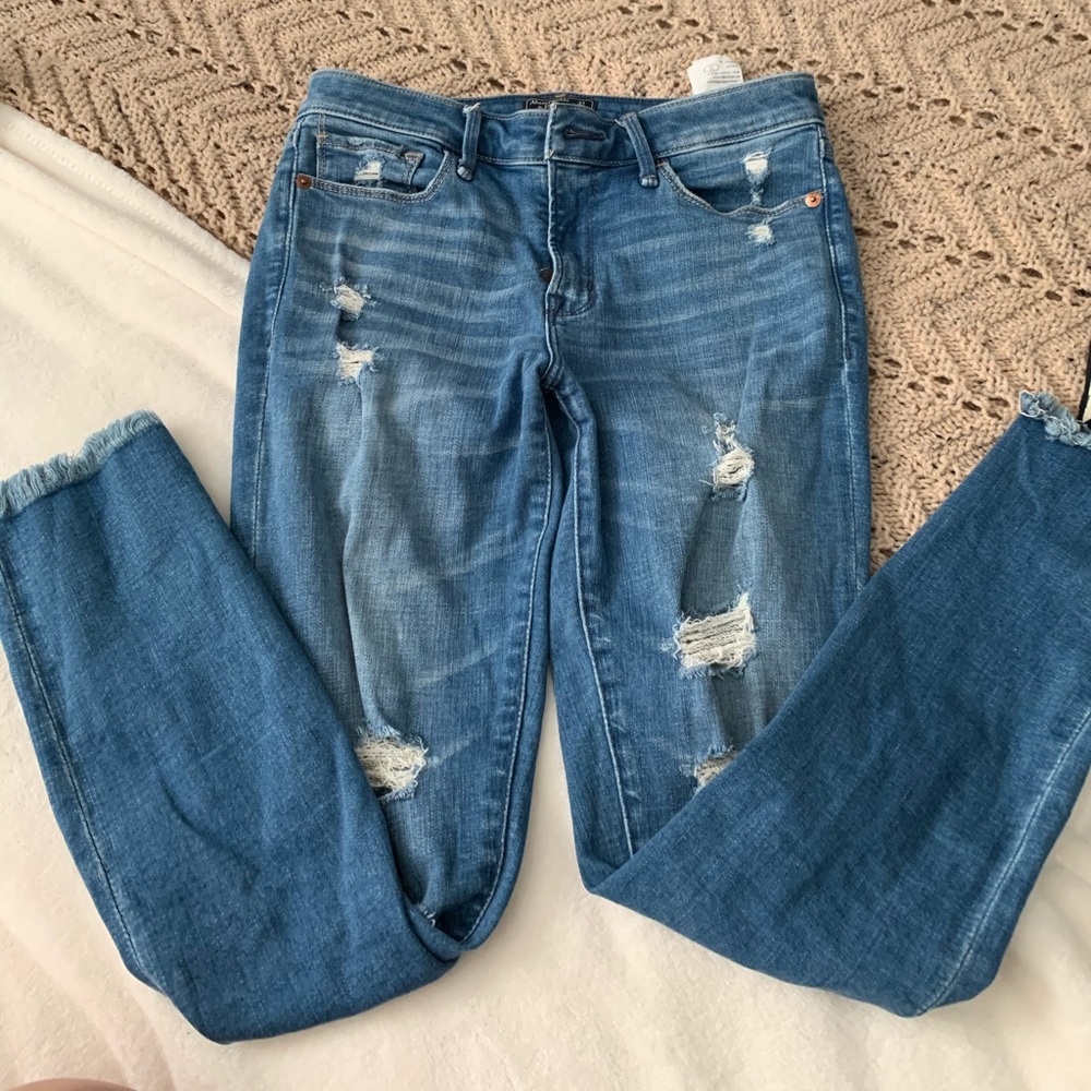 Jeans with distressed hem on bottom
